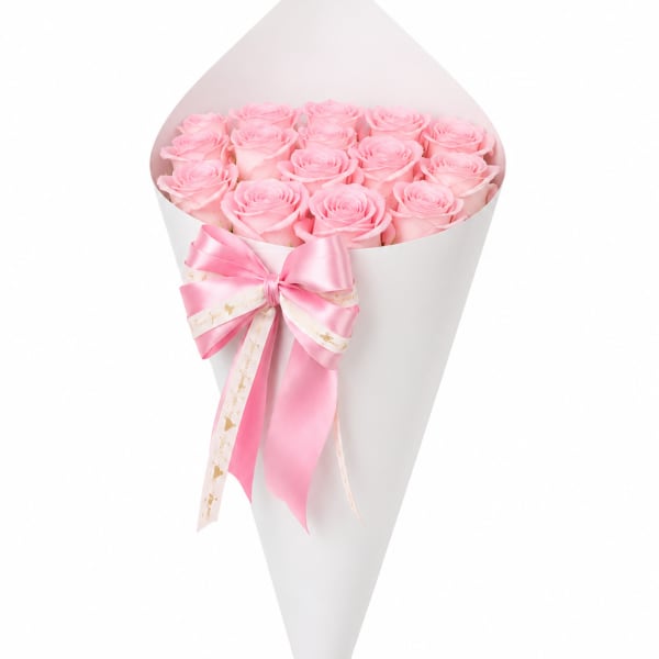 Bouquet of pink roses wrapped in white paper with a pink ribbon