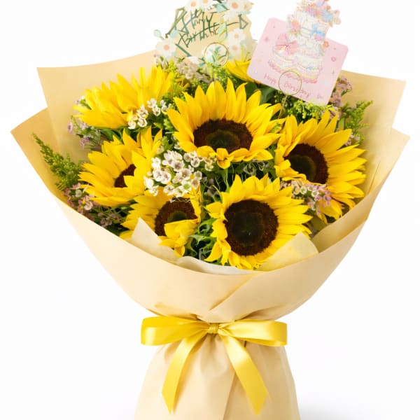 Bouquet of yellow sunflowers wrapped in beige paper with a yellow ribbon