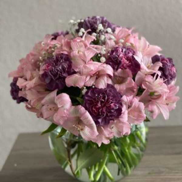 Pink and purple bouquet in a glass vase