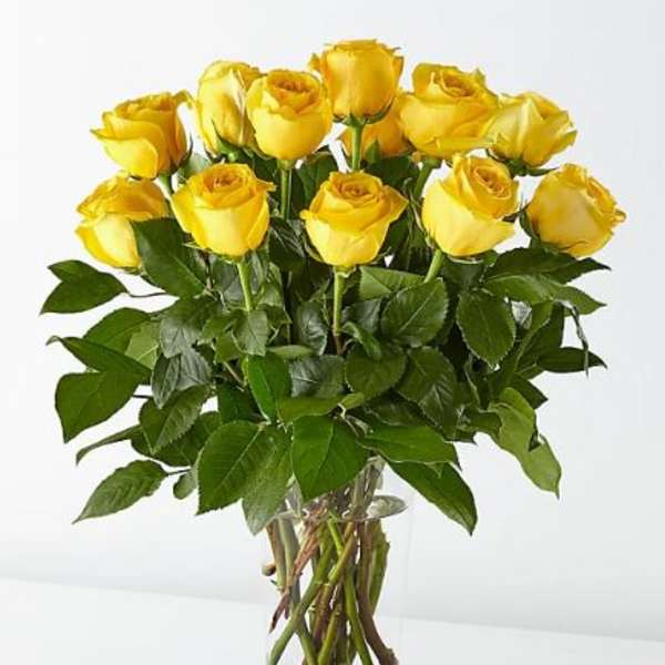 Bouquet of yellow roses in a clear glass vase