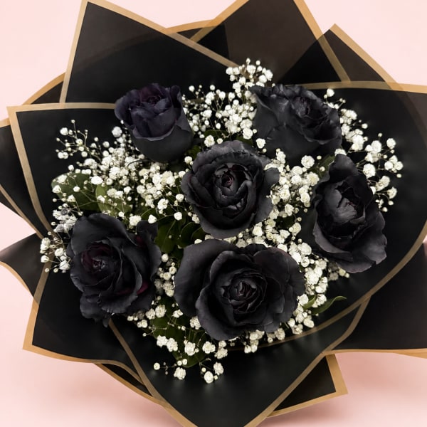 Bouquet of black roses with white baby's breath in black and gold wrap