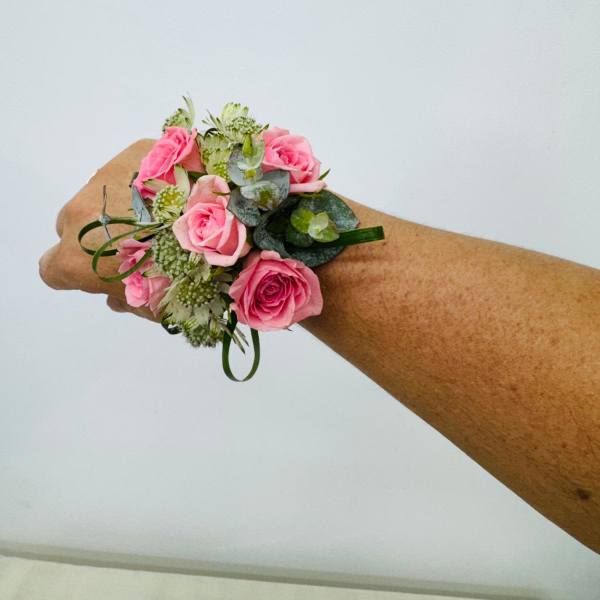 Pink rose and green filler Corsage.