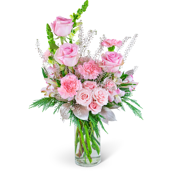 Pink roses and carnations in a clear glass vase