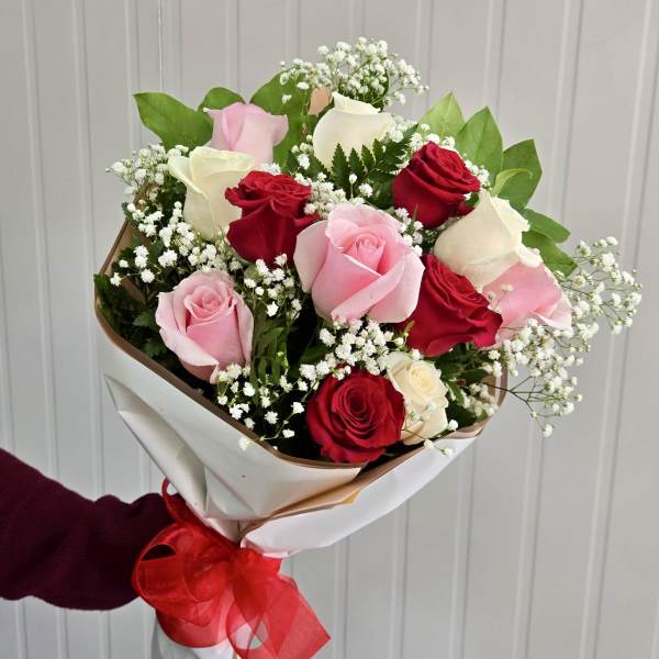Bouquet of red, pink, and white roses with baby's breath