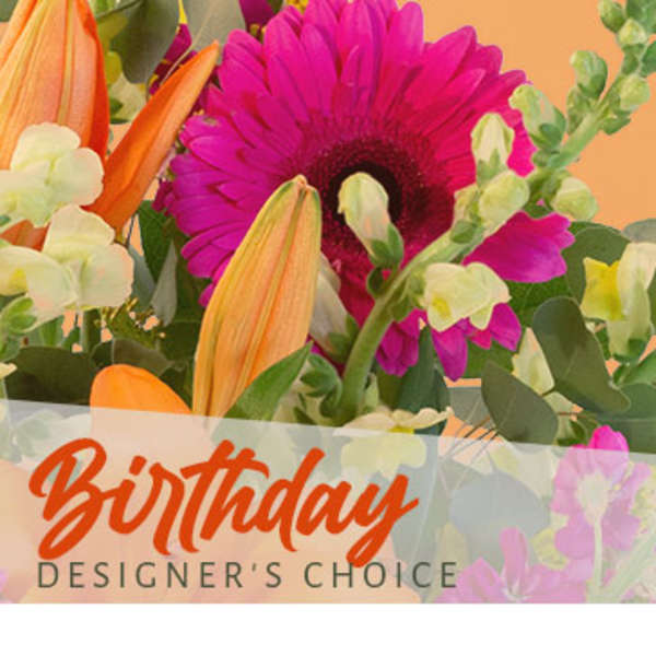 Bright mixed bouquet with a pink gerbera daisy and orange lilies