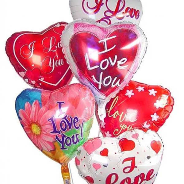 Cluster of heart-shaped Valentine balloons with love messages