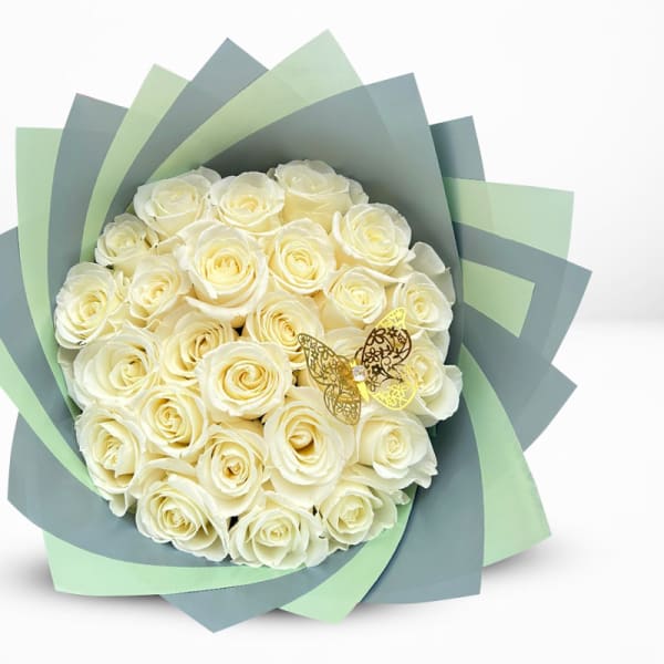 Bouquet of cream roses wrapped in layered blue and green paper
