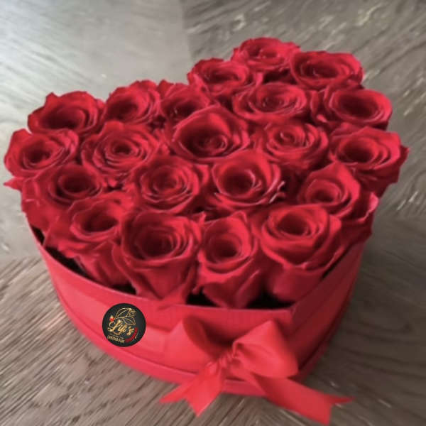 Heart-shaped box of red roses tied with a red ribbon