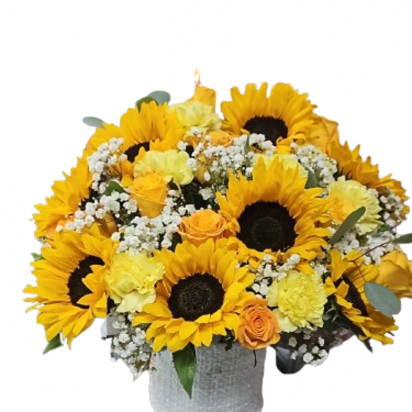 Round arrangement of sunflowers, yellow carnations, and orange roses with baby's breath in a white textured vase