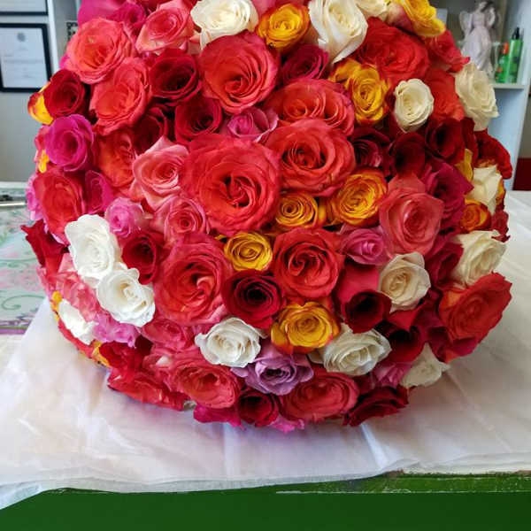 Large round bouquet of multicolored roses