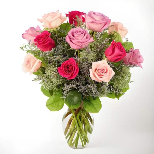 Bouquet of pink and red roses in a clear glass vase