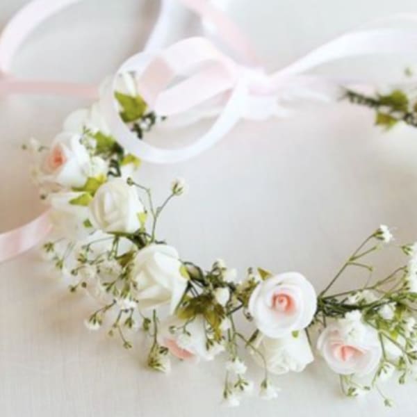 Floral crown with white and pale pink flowers on a ribbon
