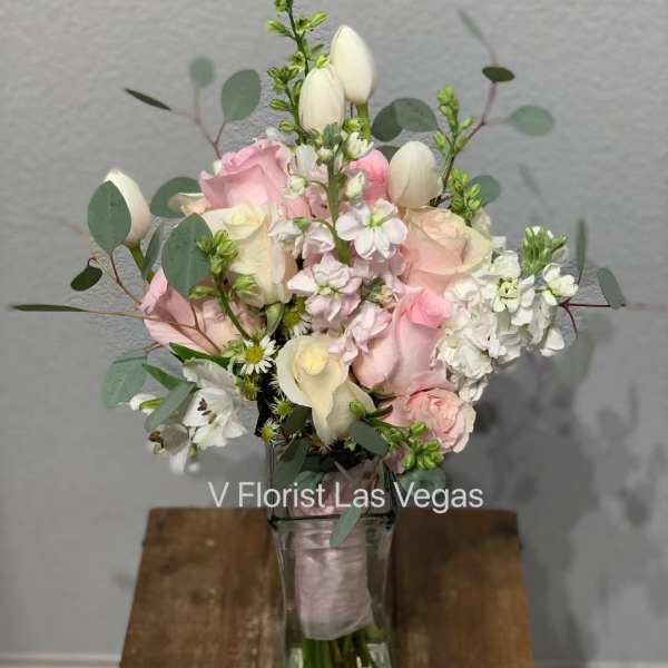 Pink and white bouquet in a clear glass vase