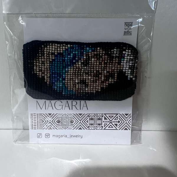 Beaded bracelet in plastic packaging with a Magaria card