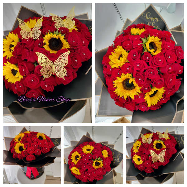 Bouquet of red roses and yellow sunflowers with butterfly decorations