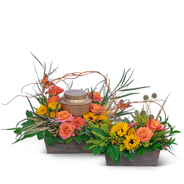 Two floral basket arrangements with a gold urn centerpiece and butterfly picks