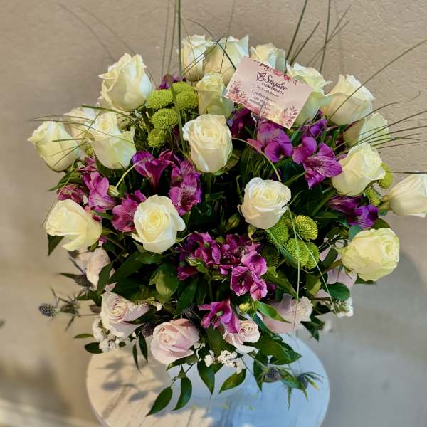 Bouquet of white roses and purple alstroemeria with green button mums