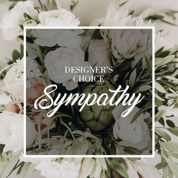 White sympathy bouquet with pale pink flowers and greenery