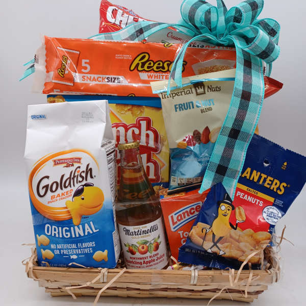 Gift basket of snacks and sparkling juice with a blue ribbon