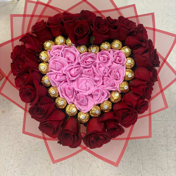 Heart artificial and natural red roses
