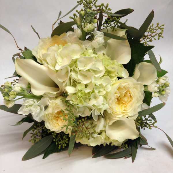 Cream bouquet with hydrangeas, roses, and calla lilies