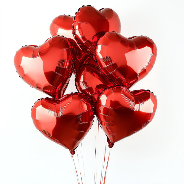 Cluster of red heart-shaped balloons on strings