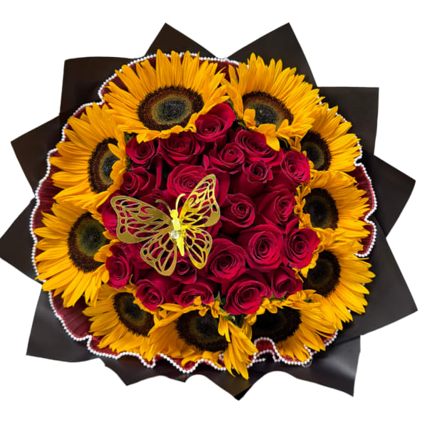 Bouquet of red roses and sunflowers with a butterfly decoration