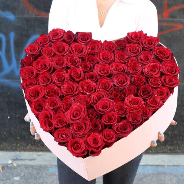 Heart-shaped box filled with red roses