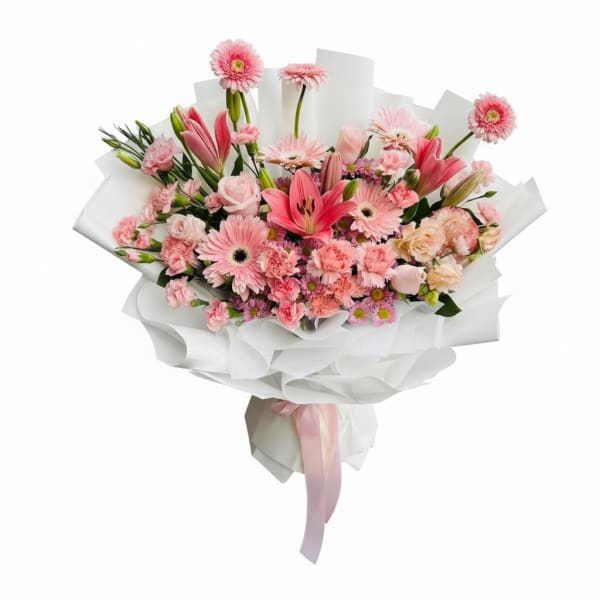 Pink mixed bouquet with lilies, gerbera daisies, and carnations wrapped in white paper