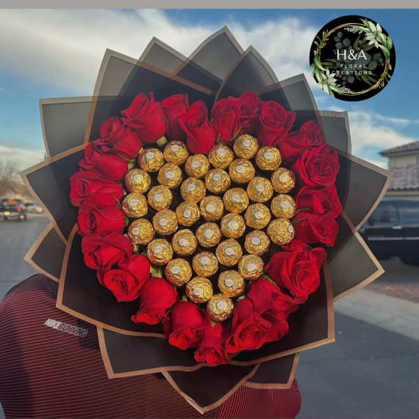 Heart-shaped bouquet of red roses and gold-wrapped chocolates