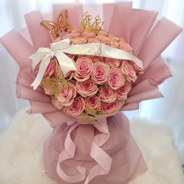 Pink rose bouquet with a crown and butterfly decorations