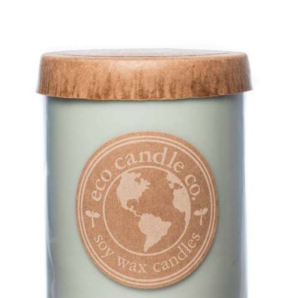 Soy wax candle in a glass jar with a wooden lid