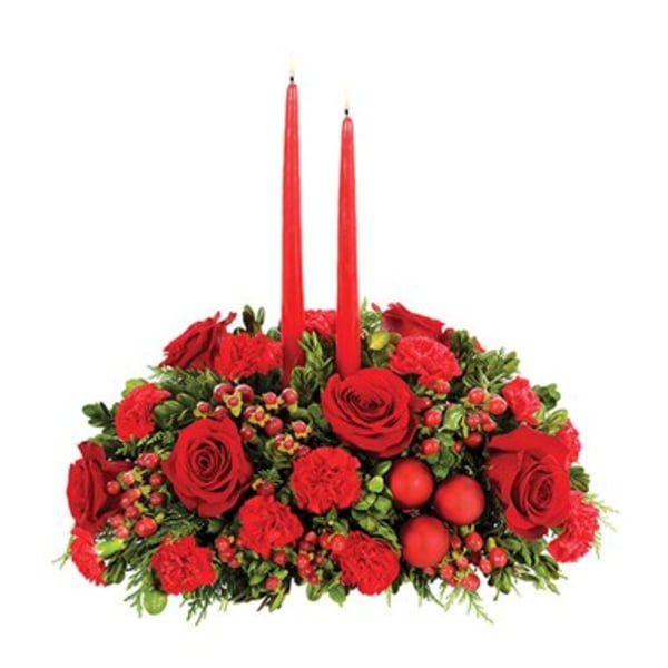 Red floral centerpiece with two tall red candles