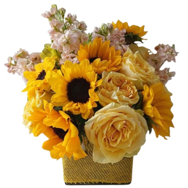 Sunflower and pale yellow rose arrangement in a square woven basket