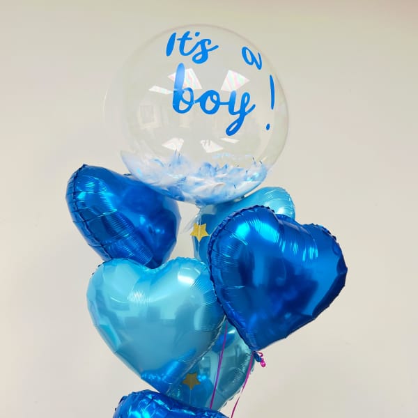 Blue heart balloons with a clear balloon reading "It's a boy!"