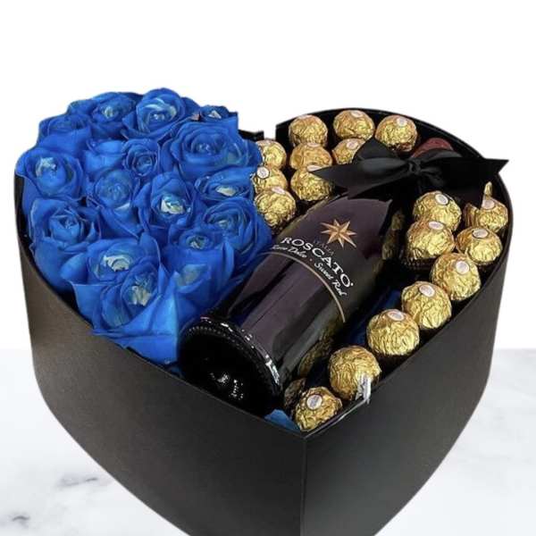 Blue roses and gold-wrapped chocolates in a black heart box