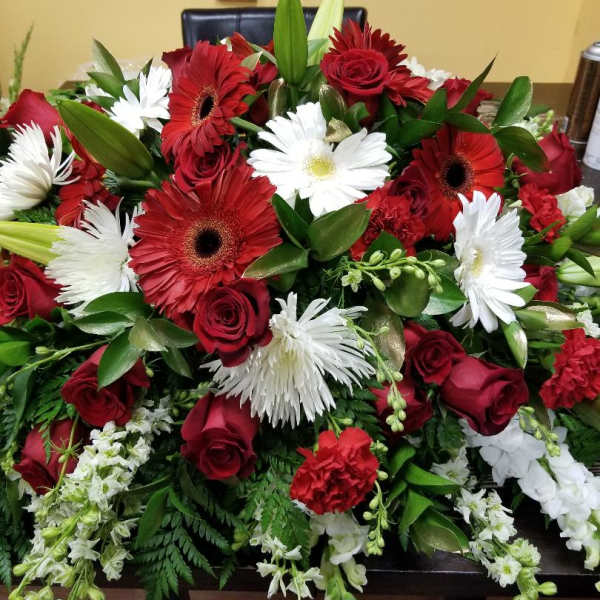 Large bouquet of red roses, red gerbera daisies, and white daisies