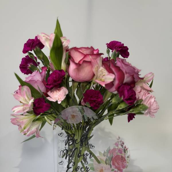 Pink roses and carnations in a clear vase with "Best Mom Ever" text