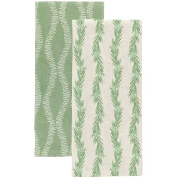 Two green patterned wrapping papers with fern-like designs