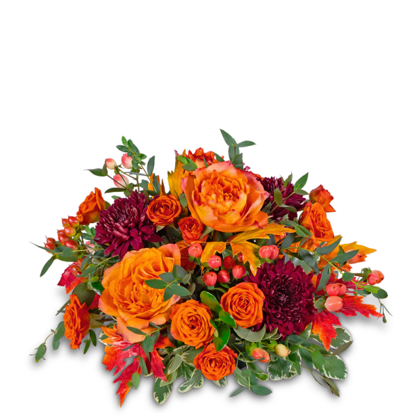 Orange roses and dark burgundy mums in a low autumn bouquet