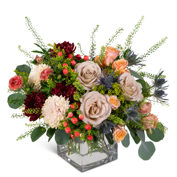Bouquet of roses and chrysanthemums in a clear square vase