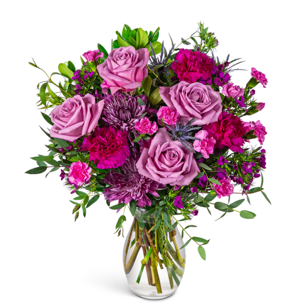 Pink and purple mixed bouquet in a clear glass vase