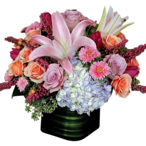 Pink lilies, roses, hydrangea, and daisies in a black square vase