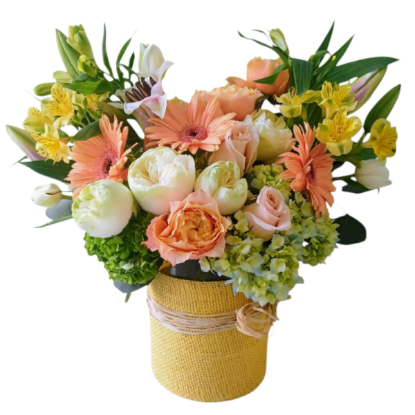 Peach and yellow mixed bouquet in a burlap-wrapped vase