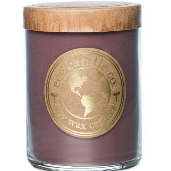 Purple candle in a glass jar with a wooden lid