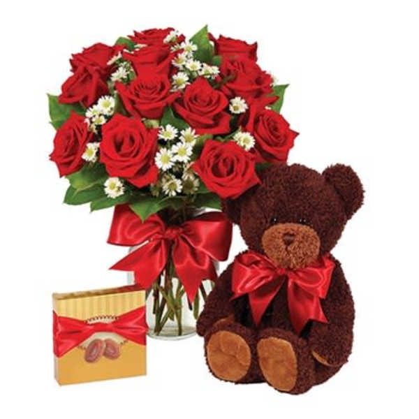 Red rose bouquet with a teddy bear and chocolate box