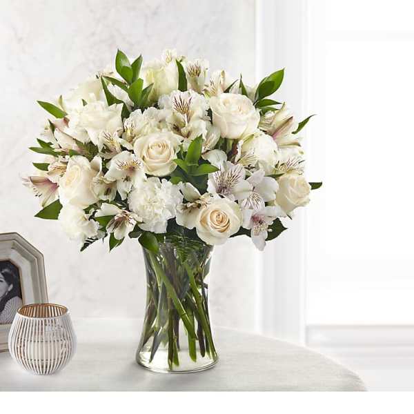 White floral bouquet in a clear glass vase