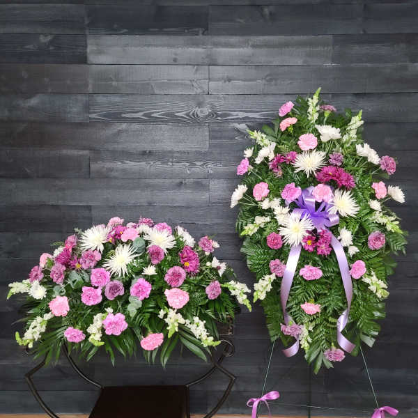 Two pink and white floral standing sprays on easels