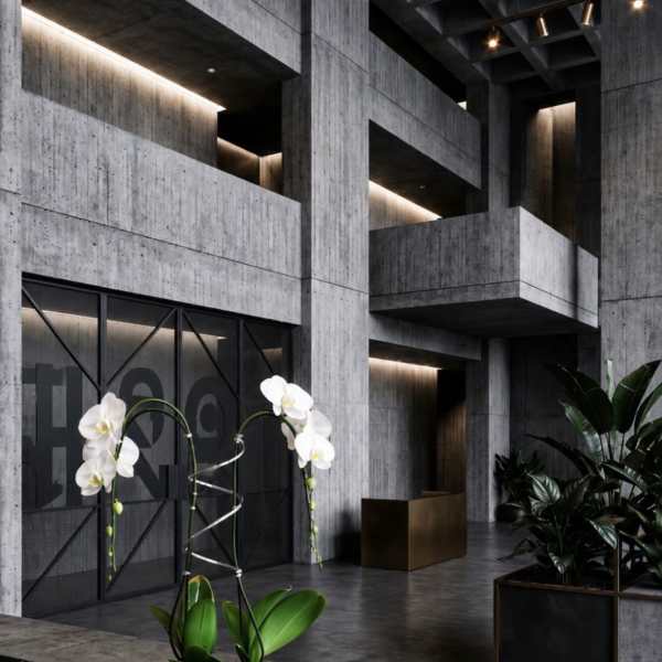 White orchids in a round white pot with a metal support