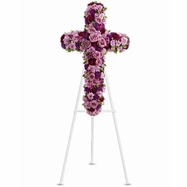 Purple floral cross on a white easel